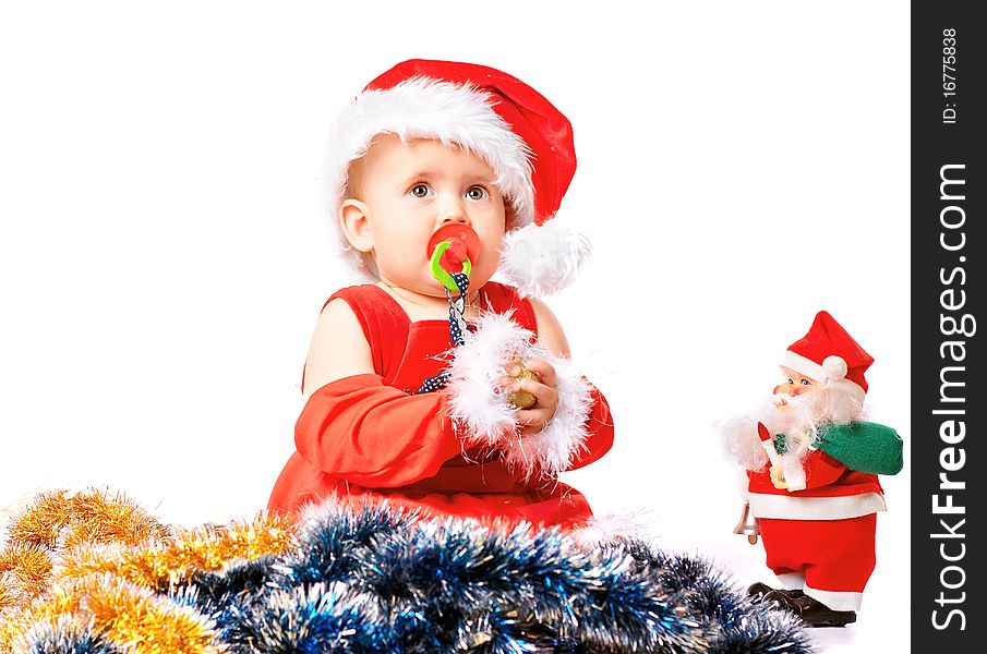 Baby in Santa Claus hat on white background