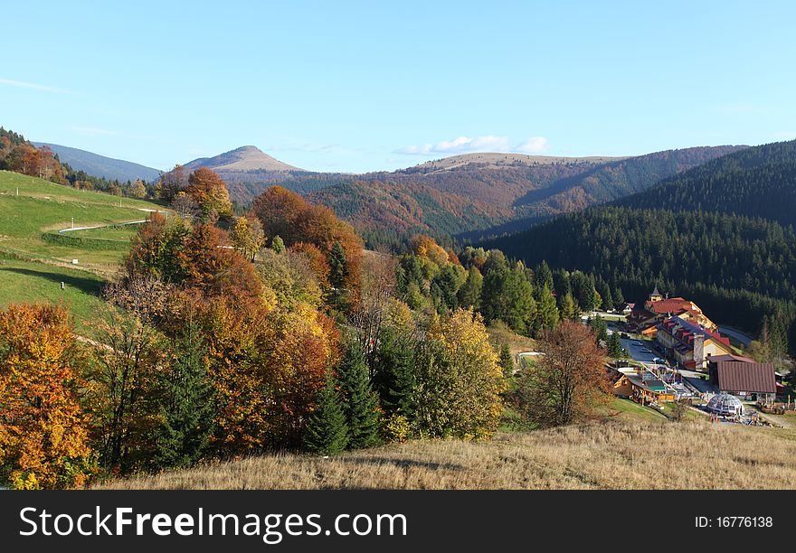 The mountain autumn landscape with colorful forest