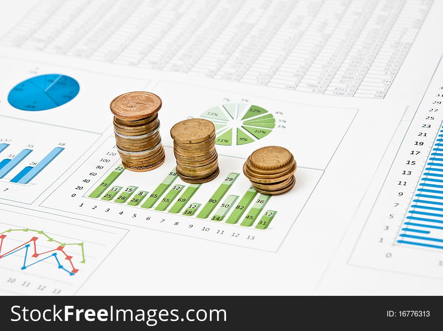 Graphs and charts with stacks of coins. Graphs and charts with stacks of coins