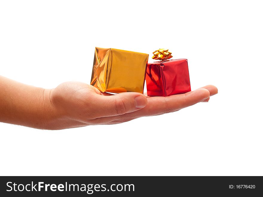 Man's hand giving a christmas gifts. Isolated on white background. Man's hand giving a christmas gifts. Isolated on white background