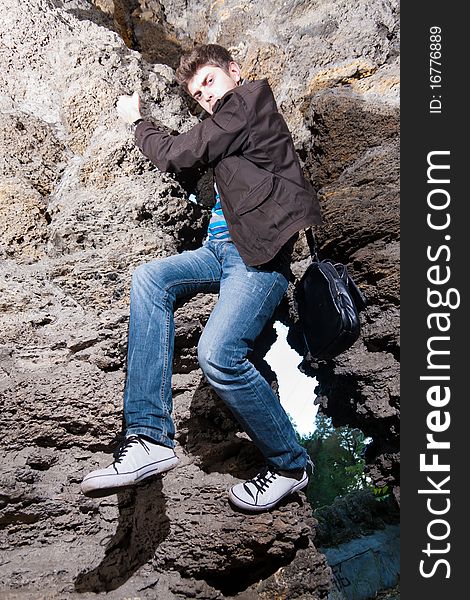 Trendy Man Climbing In The Cave