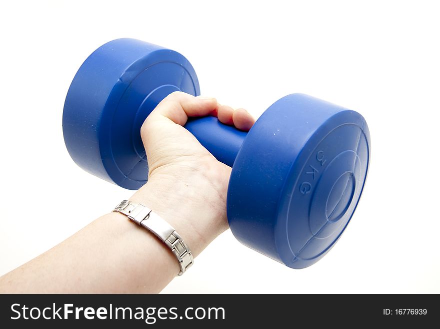 Blue dumbbell in a woman hand. Blue dumbbell in a woman hand