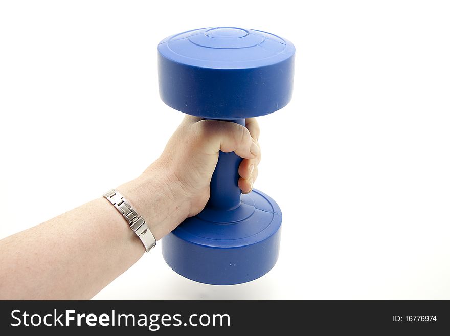 Blue dumbbell in a woman hand. Blue dumbbell in a woman hand