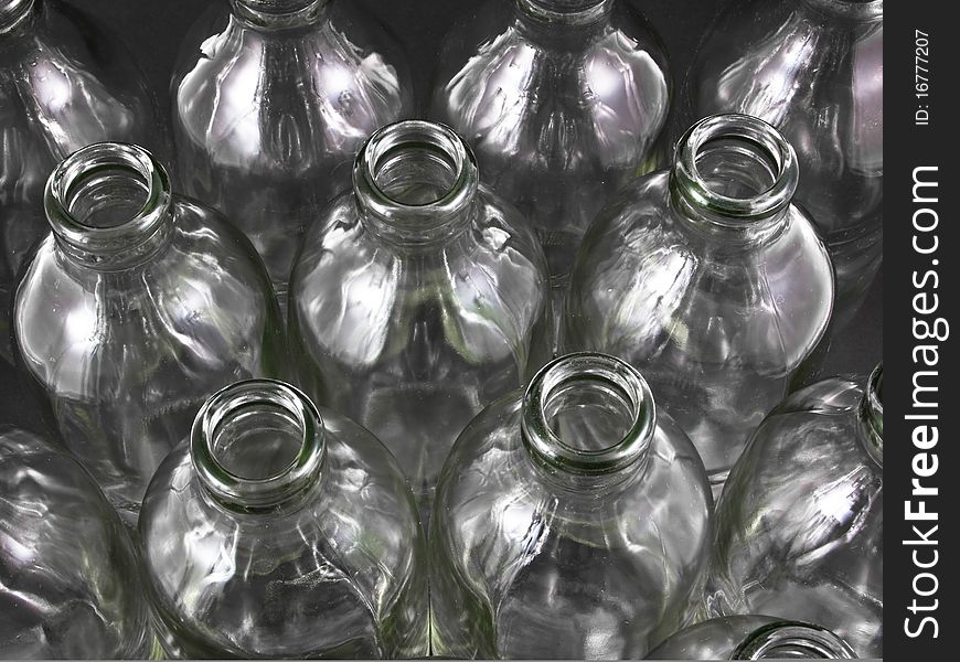 Empty bottles collection, colorless, isolated on black background