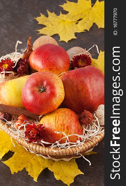 Apples in a wicker basket on table. Apples in a wicker basket on table