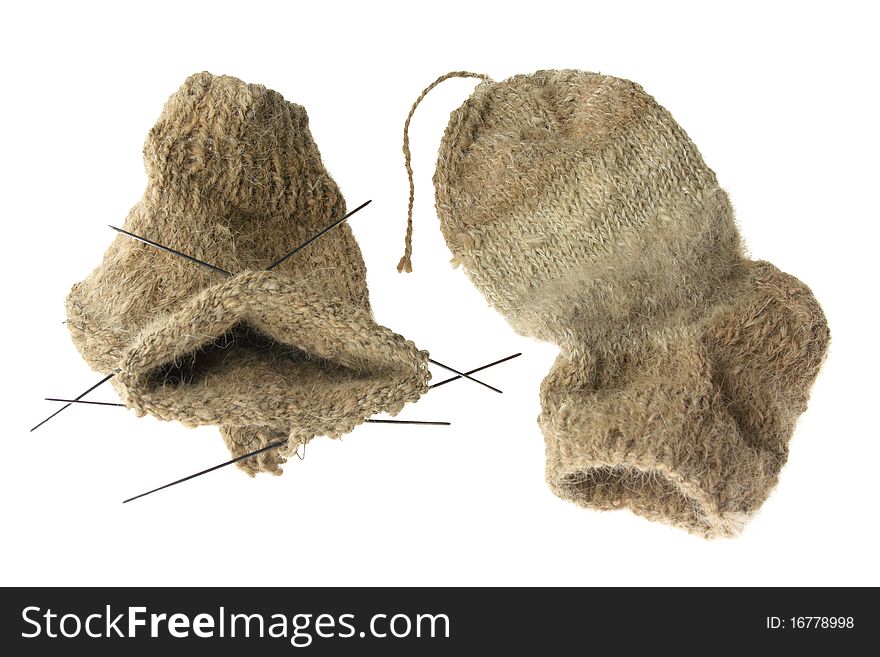 Finished and unfinished knitted socks isolated over white background. Finished and unfinished knitted socks isolated over white background