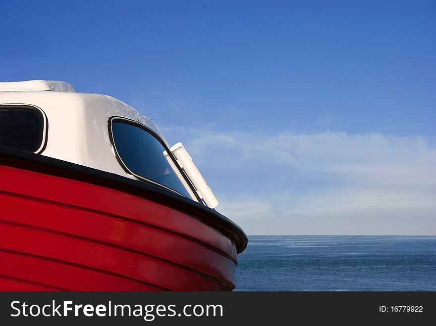 Detail of a Small Red boat with Sea and Sky in the Background. Detail of a Small Red boat with Sea and Sky in the Background