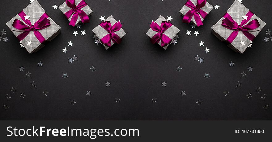 Xmas gift. Christmas gifts, red decor on black background top vi