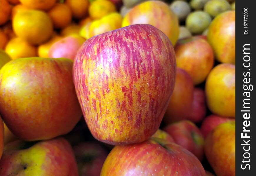 Red and yellow fresh sweet apple put on street fruits shop