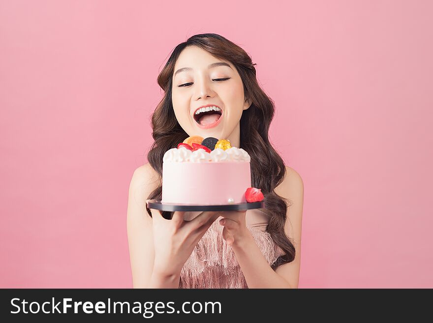 Joyful Woman With Cake Front Pink Background