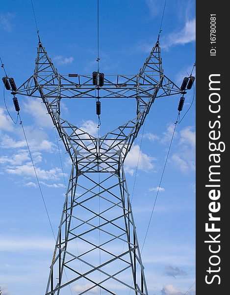 Power plant and power lines in blue sky