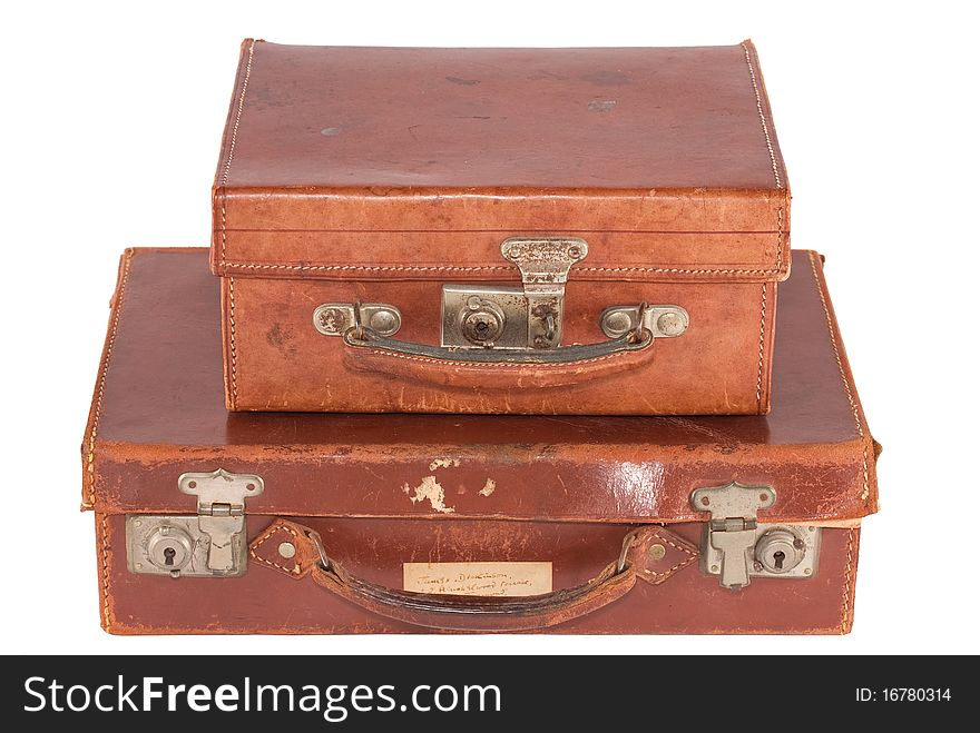 Two old fashioned leather suitcases, isolated on white