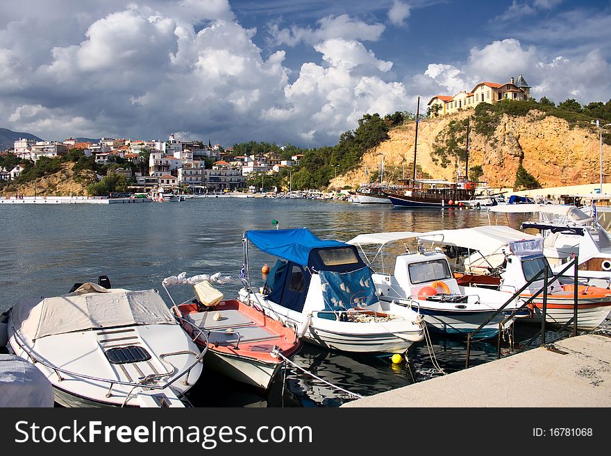 Boats And Castle In A Port In Greece