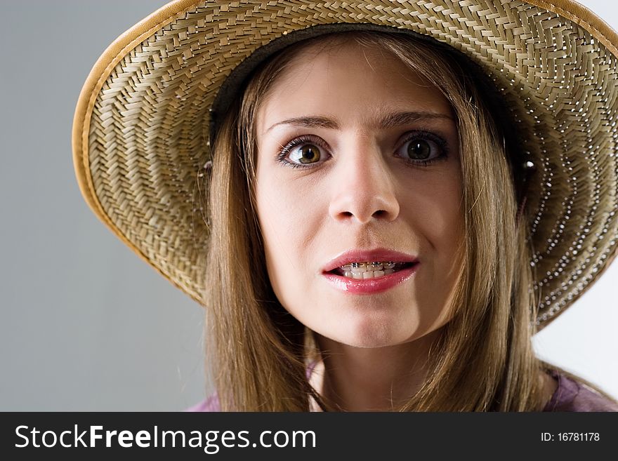 Close-up of smiling girl in hat