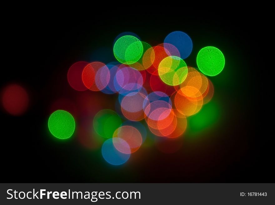 Multi-colored Christmas lights on a black background. Multi-colored Christmas lights on a black background