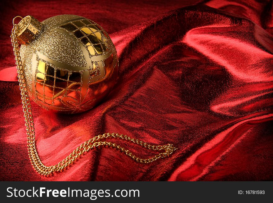 Gold baubles with red backdrop