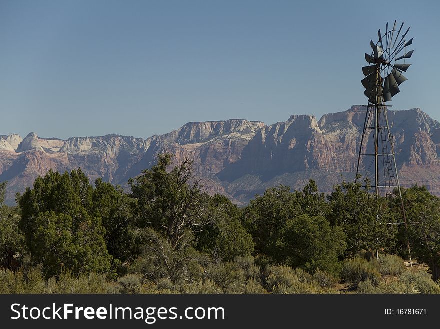 The windmill on Gooseberry Mesa's well known windmill loop, a popular mountain biking destination. Zions National Park in the background.