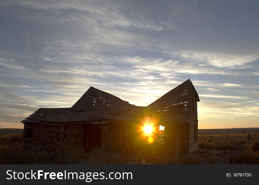 One of the few remaining structures built by the early settlers of the Short Creek valley in northern Arizona. the setting sun is shining thru the open doorway. One of the few remaining structures built by the early settlers of the Short Creek valley in northern Arizona. the setting sun is shining thru the open doorway.