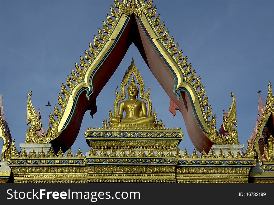 Buddha on top of the door in temple at Samut Sakhon, Middle of Thailand.