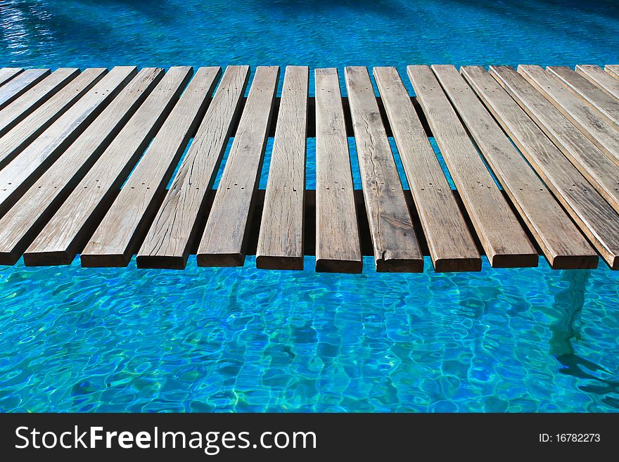 Swimming pool, a wooden bridge