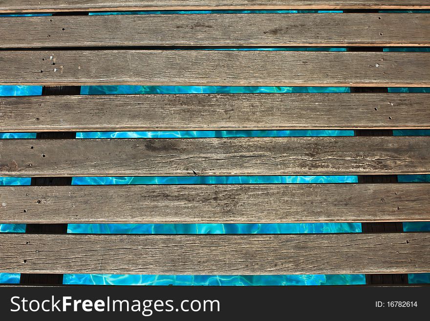 The wooden bridge in a swimming pool. The wooden bridge in a swimming pool