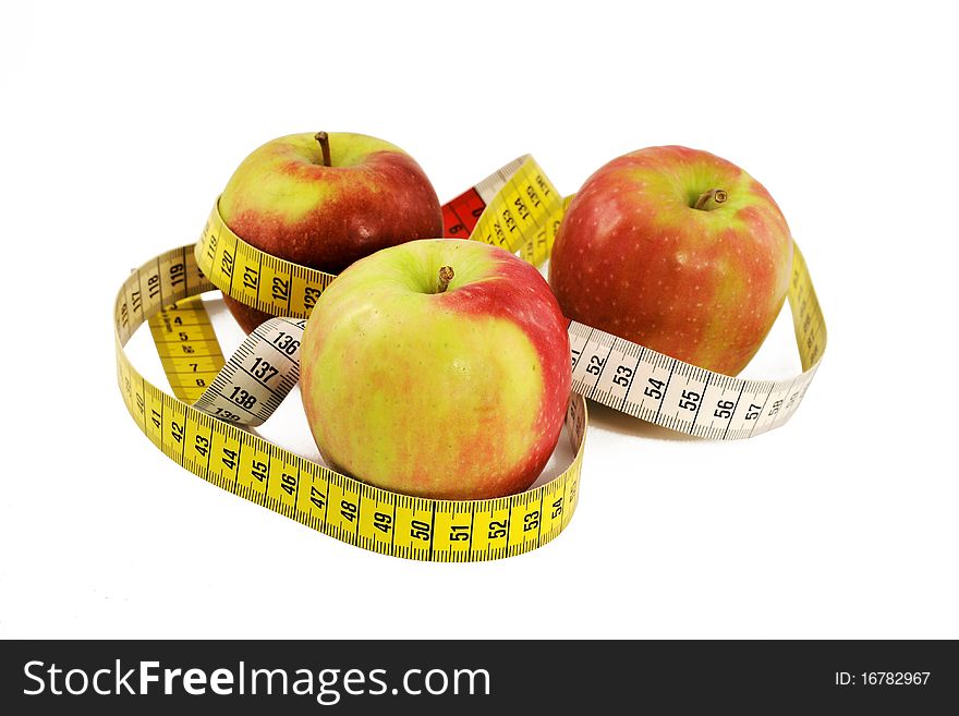 Apples with measuring tape isolated on white background