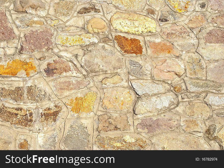 A large wall made of stones. A large wall made of stones