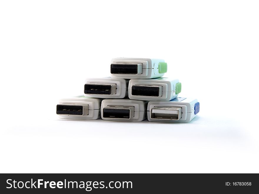 Pyramid stack of USB drive connectors on a white with soft shadow