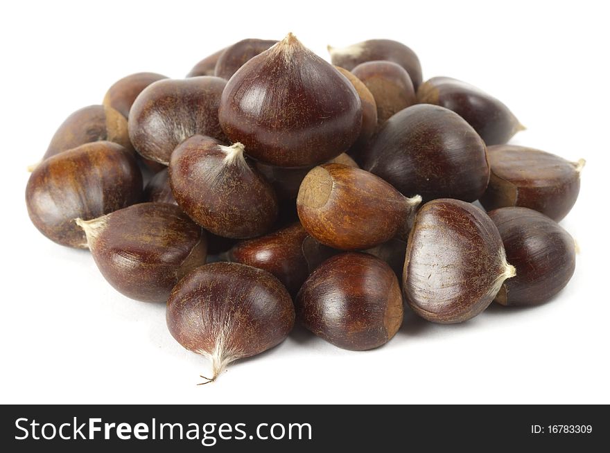 Heap of chestnuts isolated over white background. Heap of chestnuts isolated over white background