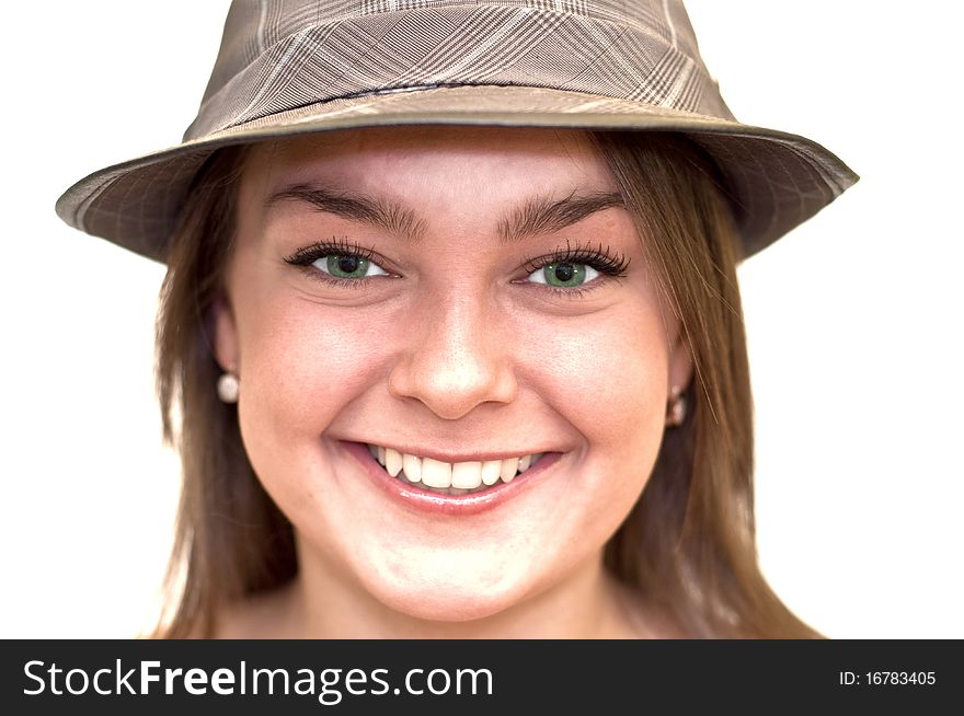 Beautiful young woman with green eyes wearing a hat. Close-up, portrait. Isolated on a white background.