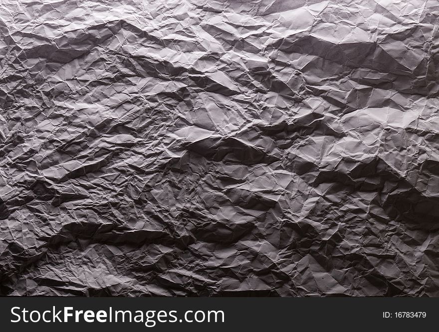 Crushed white paper in dark light Hard texture