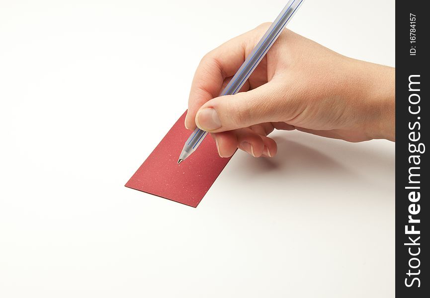 Hand holding a pen on a white background. Hand holding a pen on a white background