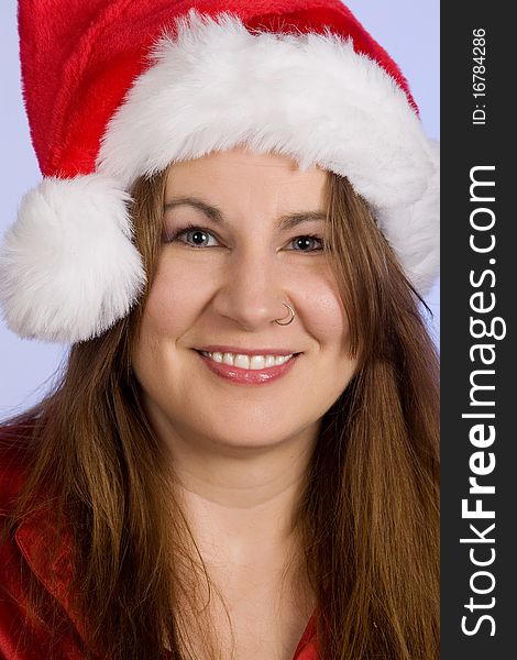 A woman in her forties wearing Santa hat. A woman in her forties wearing Santa hat