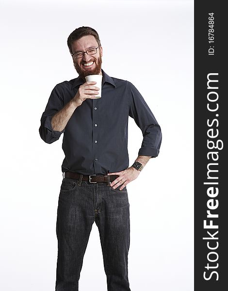 Man holding a paper coffee cup with big laugh on his face