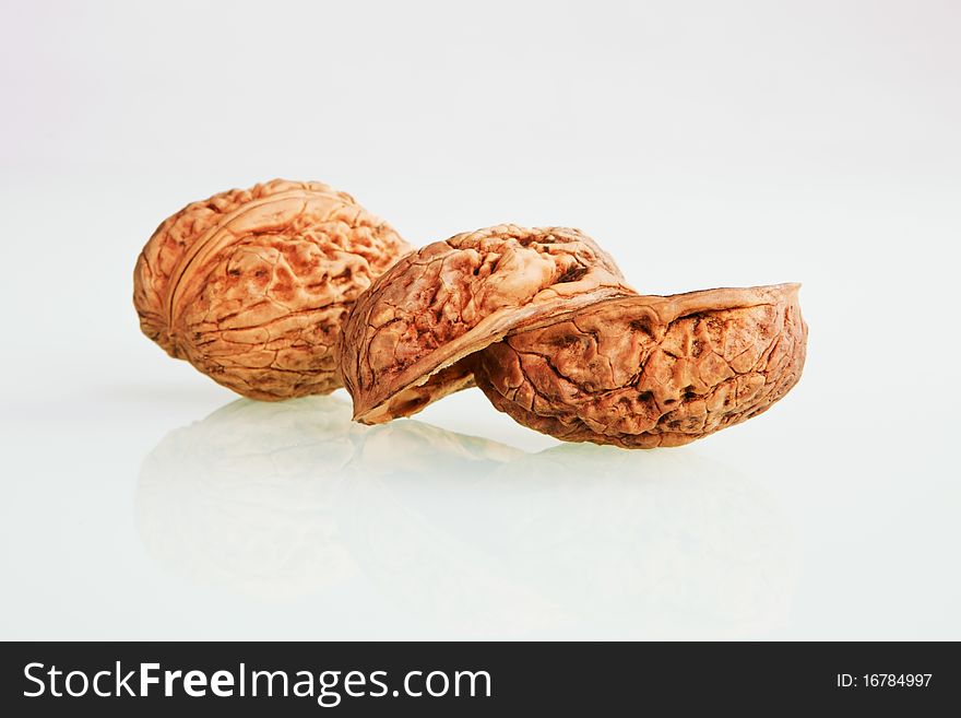 Organic walnuts isolated on white background.