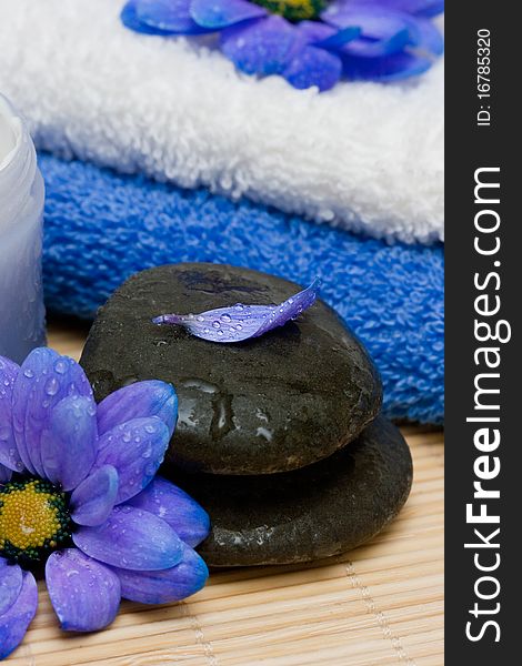 Cream, stones and towel with flowers