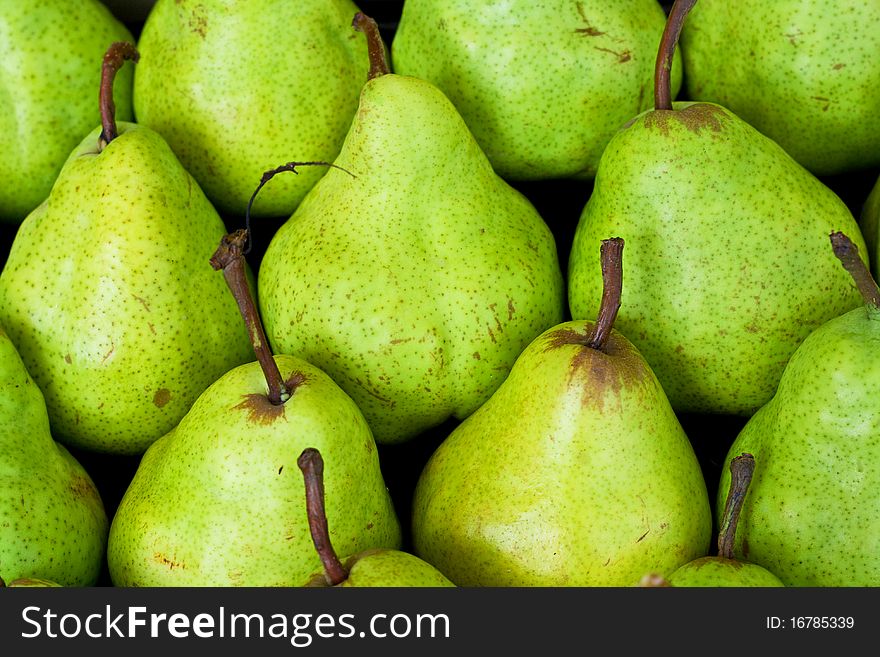 Green pear background at the market