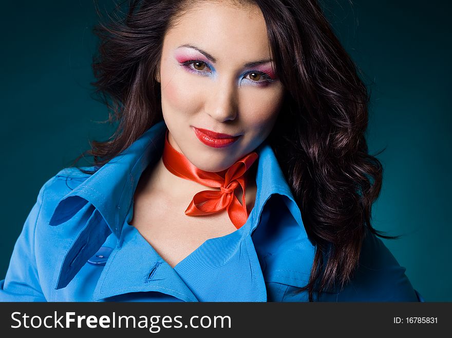 Elegant fashionable woman in blue jacket