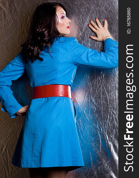 Elegant fashionable woman in blue jacket