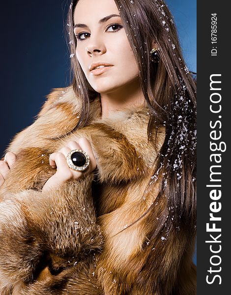 Beautiful woman in a fur coat