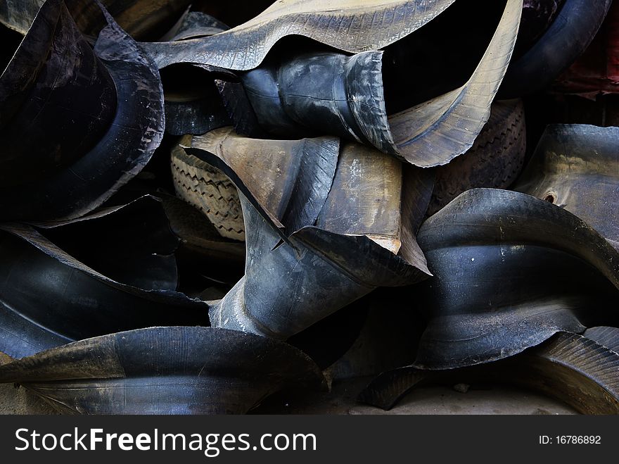 Abandoned black tires in a salvage station. Abandoned black tires in a salvage station