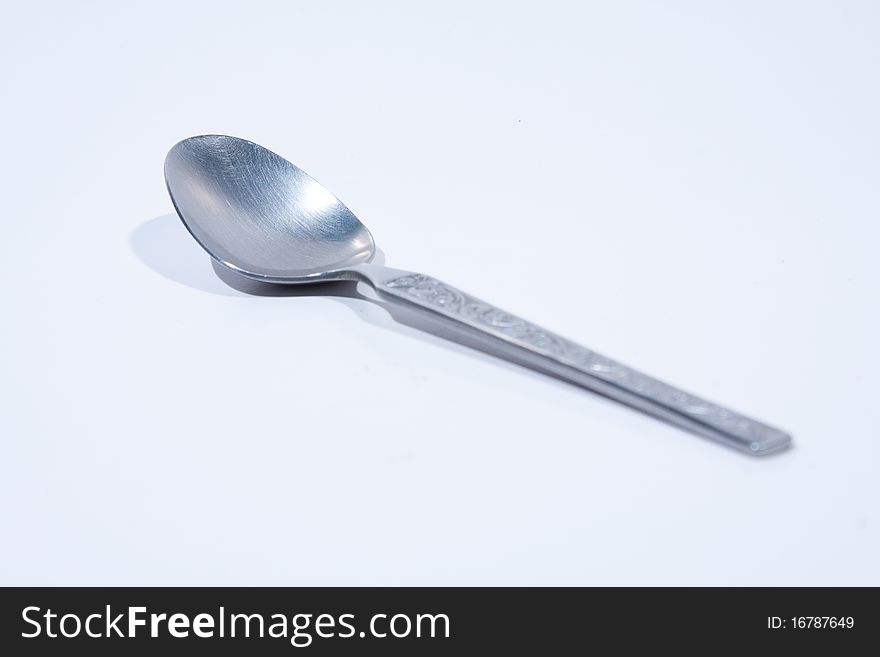 Spoon on a white background. Small spoons on white background.