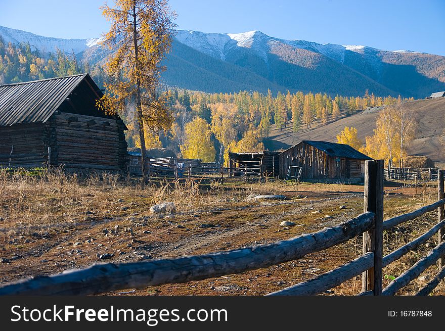 Chinese village under the snow mountain in xinjiang,china