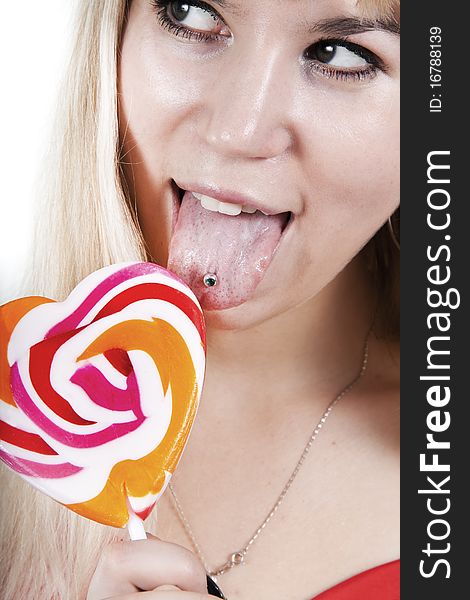 The young girl is going to eat a lollypop