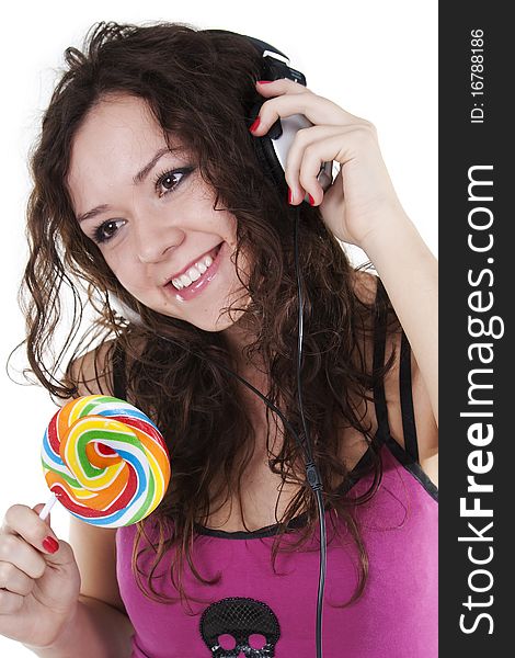 Girl In Ear-phones Dances And Eats A Lollipop