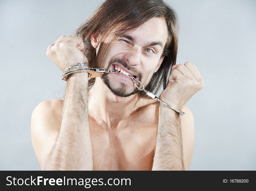 Guy Gnaws His Handcuffs