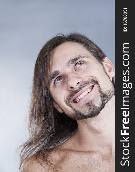 Portrait of long-haired pensive caucasian man