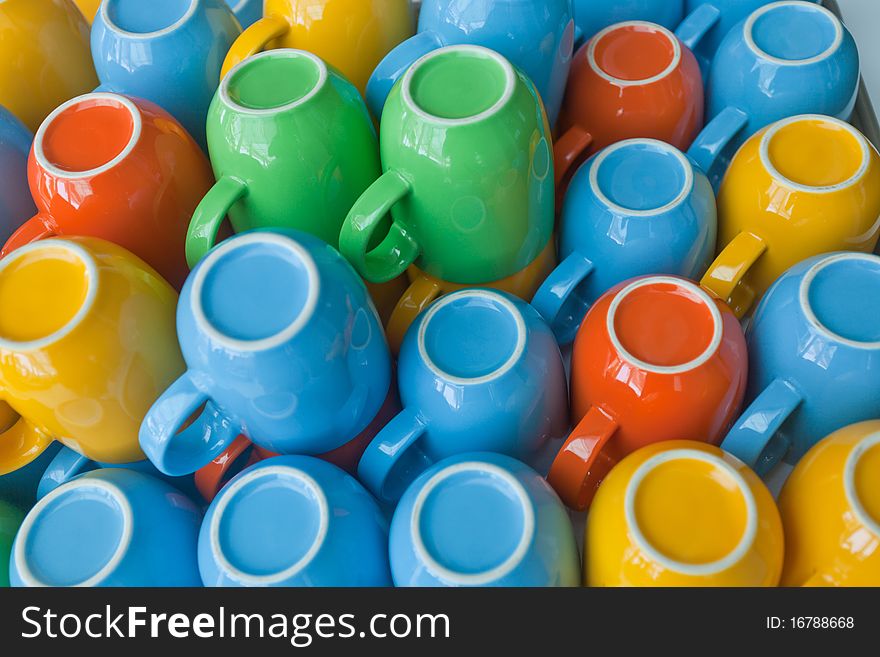 Colorful cups stacking on table. Colorful cups stacking on table