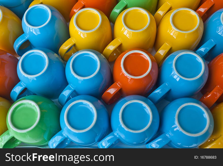 Colorful cups stacking on table. Colorful cups stacking on table