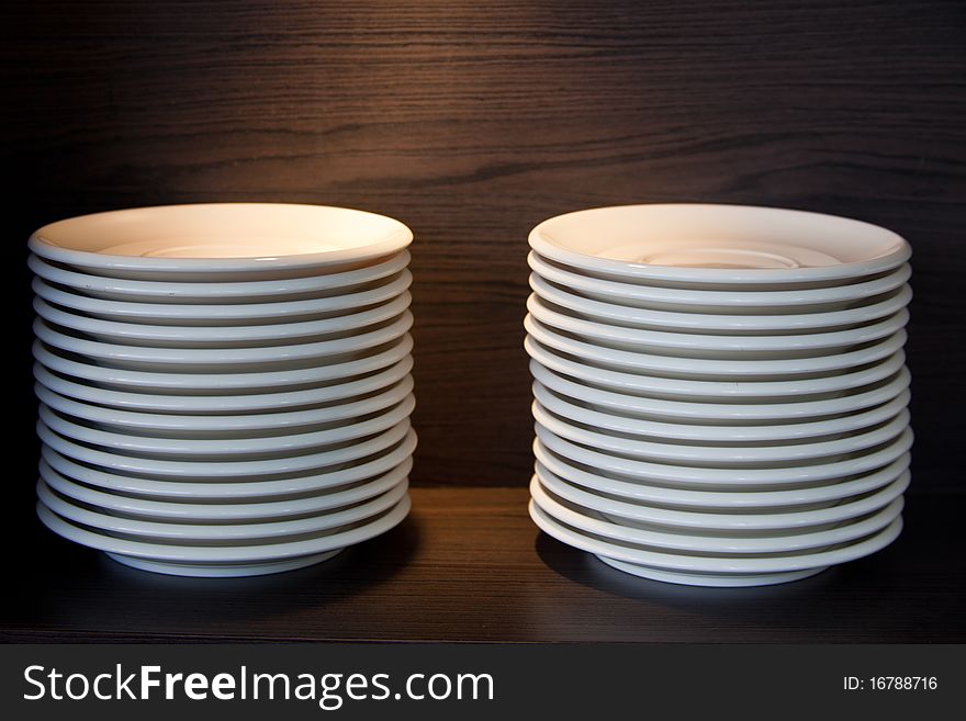 White plate stacking on the shelve. White plate stacking on the shelve